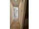 Hallway leading to a laundry area with neutral colored tile flooring at 3416 Mountain Park St, Las Vegas, NV 89129
