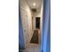 Hallway with tile flooring, white doors, and access to other rooms at 3416 Mountain Park St, Las Vegas, NV 89129