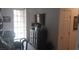 Well-lit hallway with decorative accents, leading to a bright room with a glass-paneled door at 3416 Mountain Park St, Las Vegas, NV 89129