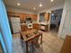 Bright kitchen includes stainless steel appliances, wood cabinets, and tile floors at 3416 Mountain Park St, Las Vegas, NV 89129