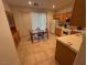 Bright kitchen features tile floors, wood cabinets, and a dining table at 3416 Mountain Park St, Las Vegas, NV 89129