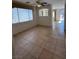 Bright living room with ceiling fan and view to the backyard at 3416 Mountain Park St, Las Vegas, NV 89129