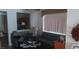 Comfortable living room with neutral tones, contemporary furnishings, and a view into the kitchen area at 3416 Mountain Park St, Las Vegas, NV 89129