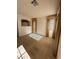View of an unfurnished room with tile flooring, a window, and open doorway providing natural light at 3416 Mountain Park St, Las Vegas, NV 89129