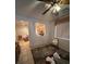 Bright living room with ceiling fan, tile flooring, and view into the kitchen at 3416 Mountain Park St, Las Vegas, NV 89129
