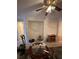 Open-concept living room features a ceiling fan, decorative niche, and tile flooring at 3416 Mountain Park St, Las Vegas, NV 89129
