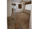 An empty living room shows the neutral wall colors and tile floors with light from a window at 3416 Mountain Park St, Las Vegas, NV 89129