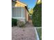This house features a side yard, neutral exterior, with a metal gate separating the front and back at 3416 Mountain Park St, Las Vegas, NV 89129