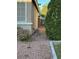 This house features a side yard, neutral exterior, with a metal gate separating the front and back at 3416 Mountain Park St, Las Vegas, NV 89129