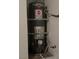 Conventional Rheem water heater with mounting hardware installed on the wall at 3416 Mountain Park St, Las Vegas, NV 89129