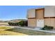 Two-story home featuring a covered parking area, a well-maintained lawn, and a symmetrical facade with a double-door entrance at 3441 Villa Way, Las Vegas, NV 89120