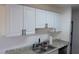 Bright kitchen showcasing white cabinets and stone countertops at 3441 Villa Way, Las Vegas, NV 89120