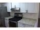 Kitchen featuring stainless steel appliances and bright white cabinetry at 3441 Villa Way, Las Vegas, NV 89120