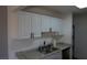 Bright kitchen showcasing white cabinets and stone countertops at 3441 Villa Way, Las Vegas, NV 89120
