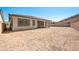 Backyard with block fencing and a covered patio is ready for your personal touches at 362 Tigullio Ave, Henderson, NV 89011