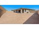 Expansive backyard ready for landscaping and outdoor living features a covered patio and privacy wall at 362 Tigullio Ave, Henderson, NV 89011