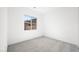 Bright bedroom featuring carpet floors and a window view of the surrounding community at 362 Tigullio Ave, Henderson, NV 89011