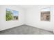 Bright bedroom featuring carpet floors and window views of the surrounding homes at 362 Tigullio Ave, Henderson, NV 89011