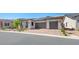 Charming single-story home with a brick driveway and desert landscaping at 362 Tigullio Ave, Henderson, NV 89011