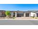 Charming single-story home with a brick driveway and desert landscaping at 362 Tigullio Ave, Henderson, NV 89011