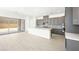 Modern kitchen with a large island, stainless appliances, and abundant natural light at 362 Tigullio Ave, Henderson, NV 89011