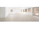 Bright and open living area featuring neutral wood-look tile flooring and abundant natural light at 362 Tigullio Ave, Henderson, NV 89011