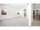 A bright main bedroom with neutral carpet and a view into the en suite bathroom at 362 Tigullio Ave, Henderson, NV 89011