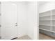 Pantry with lots of shelving and a door to the entryway at 362 Tigullio Ave, Henderson, NV 89011