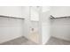 Dual walk-in closets with lots of shelving and access to the laundry area at 362 Tigullio Ave, Henderson, NV 89011