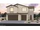 Charming two-story home with a three car garage, neutral stucco, and dark brown accents at 390 Arizona St # Lot 9, Boulder City, NV 89005