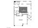 First floor floorplan featuring a 3-car garage, open kitchen and dining space, and living room at 390 Arizona St # Lot 9, Boulder City, NV 89005