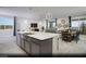 Spacious open kitchen with a large island, stainless steel appliances, and eat in dining area at 390 Arizona St # Lot 9, Boulder City, NV 89005