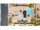 Expansive aerial view of a home with a pool, solar panels, and meticulous desert landscaping at 4624 Leon De Oro Dr, Las Vegas, NV 89129