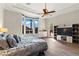 Spacious bedroom boasts tray ceiling, wood-look floors, bay window, and backyard access at 4624 Leon De Oro Dr, Las Vegas, NV 89129