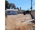 Dirt lot featuring debris and unkept grasses in the backyard at 4931 Nevada Ave, Las Vegas, NV 89104