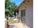 Rear exterior showing weathered siding and a sliding glass door at 4931 Nevada Ave, Las Vegas, NV 89104