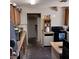 Basic kitchen with wooden cabinets and essential appliances at 4931 Nevada Ave, Las Vegas, NV 89104