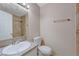 Bright bathroom with a granite countertop vanity, toilet, and tiled shower, offering a clean and functional space at 520 Prince Alan Ct, Las Vegas, NV 89110