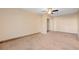 Comfortable carpeted bedroom with neutral walls and ceiling fan at 520 Prince Alan Ct, Las Vegas, NV 89110