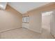 Cozy bedroom with tile floors and closet, adjacent to a hallway at 520 Prince Alan Ct, Las Vegas, NV 89110