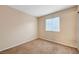 Cozy bedroom with soft carpet, window for natural light, and neutral paint, creating a warm atmosphere at 520 Prince Alan Ct, Las Vegas, NV 89110