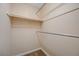 Walk-in closet interior featuring a minimalist design with built-in shelving and carpet at 520 Prince Alan Ct, Las Vegas, NV 89110