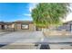 Charming single-story home featuring a spacious driveway and mature shade tree at 520 Prince Alan Ct, Las Vegas, NV 89110