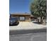 Charming single-story home with a well-maintained front yard, secure driveway gate, and mature tree at 520 Prince Alan Ct, Las Vegas, NV 89110