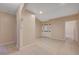 Expansive living room featuring tile floors, arched doorways, and neutral paint at 520 Prince Alan Ct, Las Vegas, NV 89110