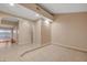 Bright living room with tile flooring and sliding glass doors to the backyard at 520 Prince Alan Ct, Las Vegas, NV 89110