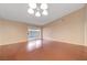 Large living room featuring hardwood floors, sliding glass door, and neutral paint at 520 Prince Alan Ct, Las Vegas, NV 89110