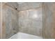 Newly remodeled walk-in shower featuring light-colored tile walls and modern fixtures at 520 Prince Alan Ct, Las Vegas, NV 89110