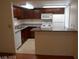 Cozy kitchen featuring breakfast bar, and essential appliances at 5383 Indian River Dr # 327, Las Vegas, NV 89103