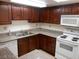 Well-maintained kitchen with granite-style counters and modern white appliances at 5383 Indian River Dr # 327, Las Vegas, NV 89103
